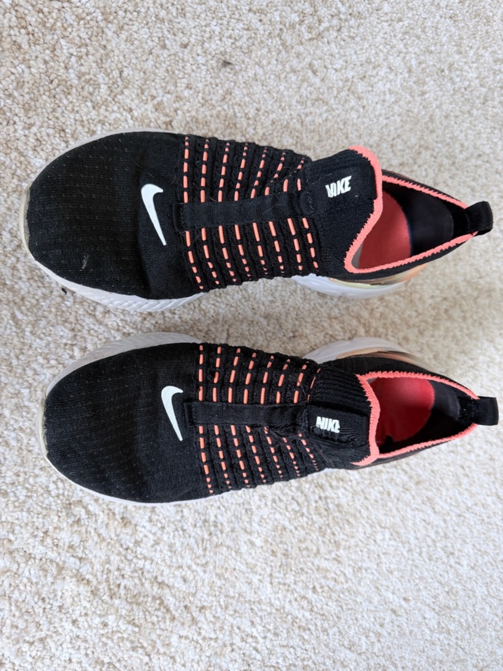 Nike Black Slip-On Sneakers with Coral Accents and White Swoosh
